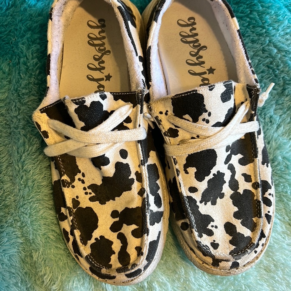 Off brand cow print hey dudes. Size 8